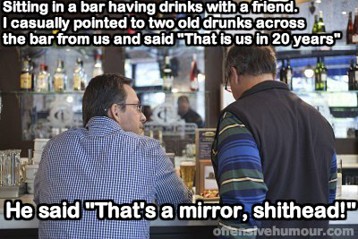 2 guys sitting at a bar